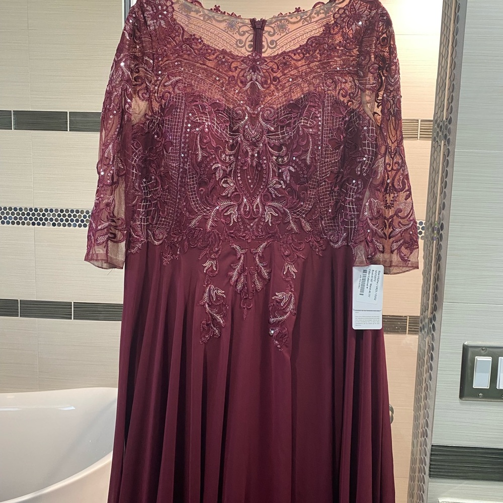 Mother of the bride/groom beaded formal gown. New with tags. Never worn.